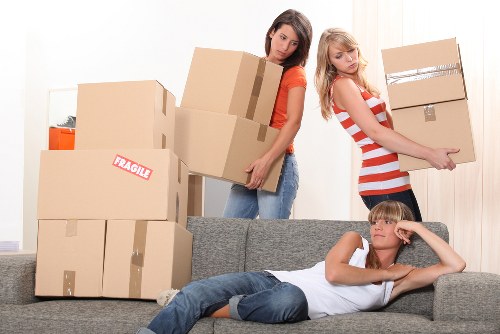 Organized short-term storage unit in Greenwich with packed boxes and furniture